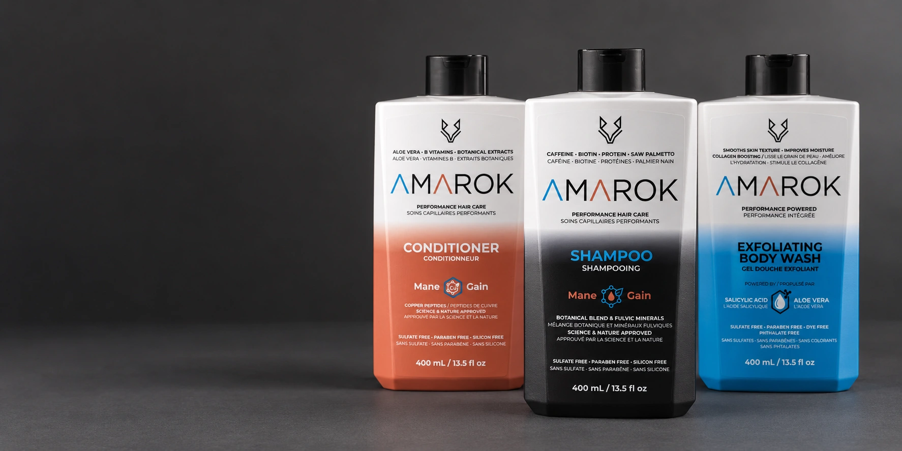 Studio-style presentation of Amarok shampoo, conditioner and exfoliating body wash
